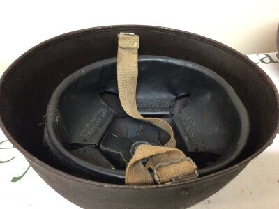 An interesting British Military helmet the shape conforming to Airborne Paratrooper the lining conforming to a Mk III British Turtle helmet. Possibly Circa 1945.