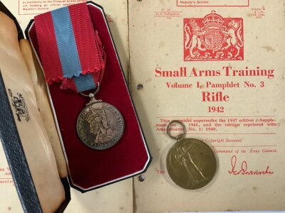 Mixed lot, Elizabeth II Faithful service medal awarded to HERBERT JAMES WILLIAM HUSSEY boxed, Great War medal awarded to 31328, PTE.P EVERSON. NORF. R, Album of photos taken C.1945 Belgium/ Italy etc. Small arms training manuals VOL 1 1937 Rifle, VOL 1 1942 Rifle, VOL 1 1937 GRENADE.