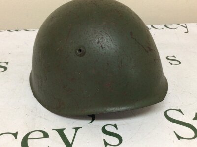 An Italian Army II world war combat steel helmet M33 pattern with lining.
