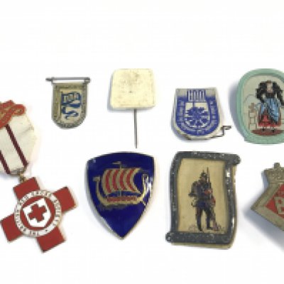 A collection of Badges including a British BIF trade buyers badge numbered back A32276 rare badge, a British Red Cross medal awrded to 39390 NH Rouse and other mid 20th century badges.