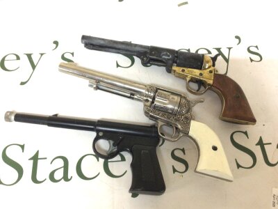 A Vintage Cat Air Pistol spud gun maker TJ Harrington & Son England and two other non firing replica revolvers