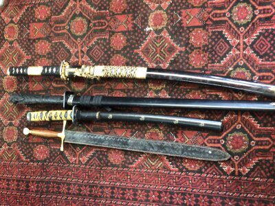 Two 20th century Japanese Ceremonial Samurai Swords with elaborate decoration a Tanto and one other sword (4)