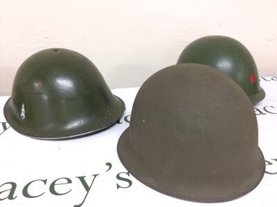 Three various steel helmets