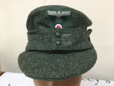 A WW2 German Third Reich M43 Field cap (Einheitsfeldmütze) inscribed Knagge & Peltz