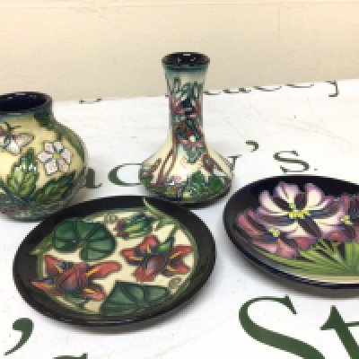 Two small Moorcroft dishes and two vases no obvious damage marks to the bases. Height 11cm