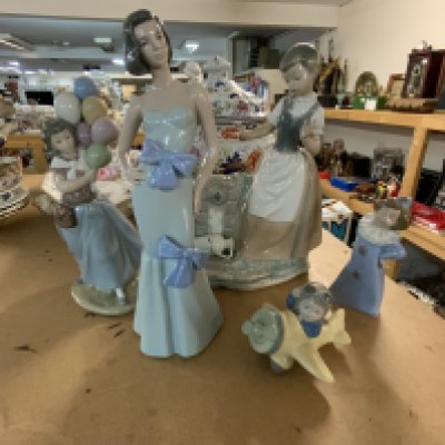 A small collection of Lladro and NAO porcelain figurines.