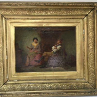 A Continental oil painting on canvas in a wide gilt frame two seated figures in an interior. 71cmx63cm
