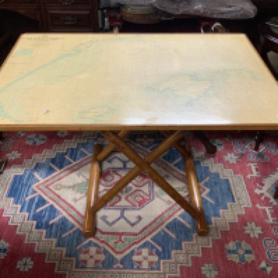 A Folding ships table inset with a map of the Balearic Islands, 105cm x 73cm adjustable height.- NO RESERVE