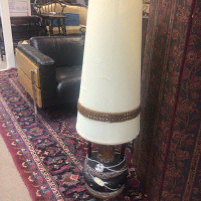 A mid 20th century floor lamp with a brown glazed ceramic base and elongated shade.- NO RESERVE