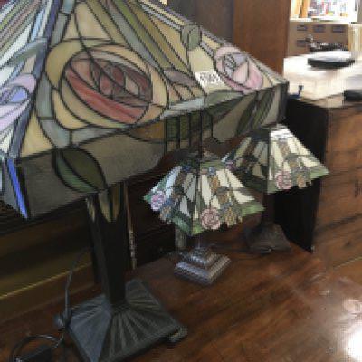 Three Tiffany style lamps .