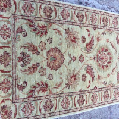 A Afghan floral design on ivory field runner 245 x 80 cm .