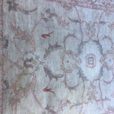 A Afghan rug with floral design on ivory field. 210 cm x 150 cm