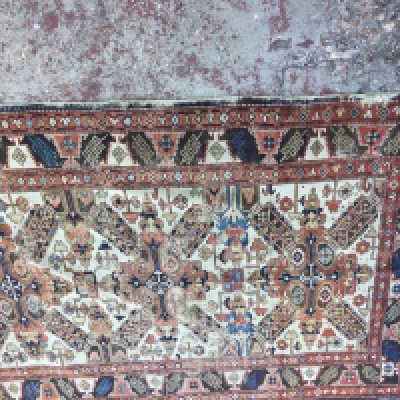 A Persian rug with central geometric pattern. 150 x 118 cm .