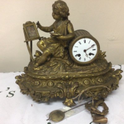 A Fench late 19th century gilt metal clock the case with a young neo classical artist at an easel with pendulum. Makers stamp to the movement Height 35cm width 40cm.