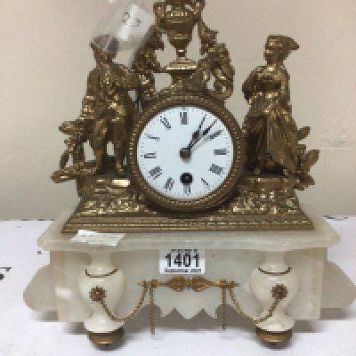 A French gilt metal and white marble mantle clock the case surmounted with Louis XVI style figures with key and pendulum. Height 31cm