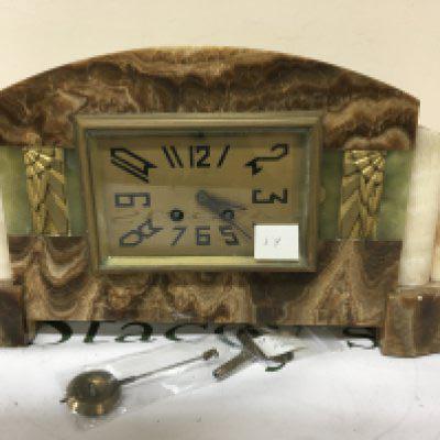 An Art Deco French marble mantle clock with key and pendulum. the rectangular dial with Paris maker length 45cm