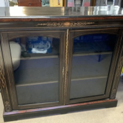 A Victorian Ebonized double width pier cabinet with walnut and fruitwood inlay and gilt metal mounts. 119cm x 35cm x 102cm. (D)