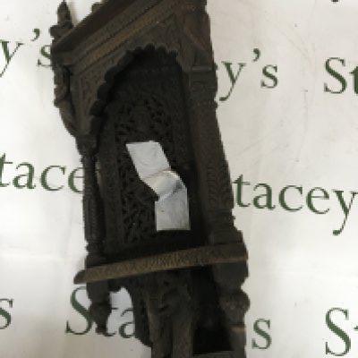 A 19th century carved hardwood Indian corner bracket. Profusely carved with raised figures.