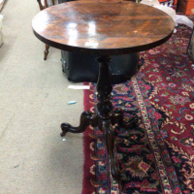 A quality rosewood occasional table the circular top on a turned column and splayed legs. top loose but good colour. Top diameter 52cm