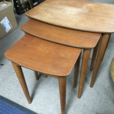 A teak nest of tables , largest 48cm tall