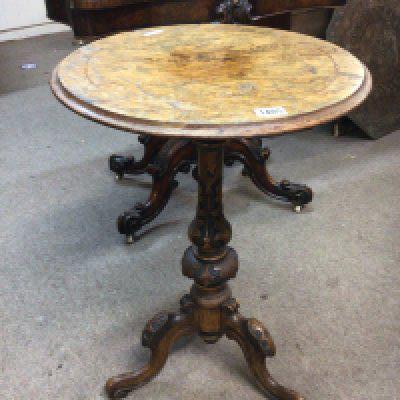 A Victorian walnut occasional table the circular top on a carved coloum. top loose.