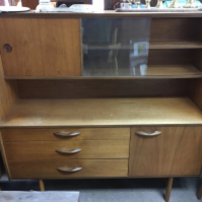 A teak display cabinet 135cm wide 50cm long 135cm tall