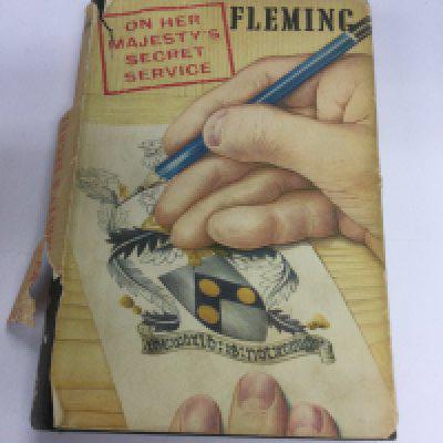 A first edition of Ian Fleming's On Her Majesty's Secret Service. Dust jacket torn.- NO RESERVE