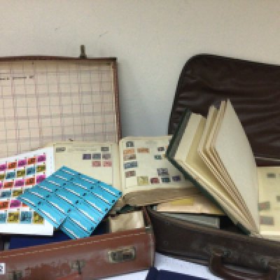 Two Cases containing World stamps in albums and unused British pre-decimal stamp sheets pictorial.An album virtually complete The Coronation of George VI British Commonwealth and Empire. World stamps in albums containing both used and unused stamps. Many loose an intresting collection.
