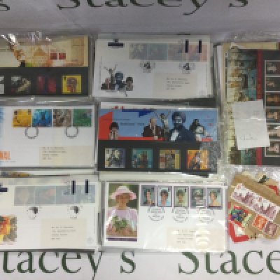 Three tins of stamps and presentation packs. Shipping category C.