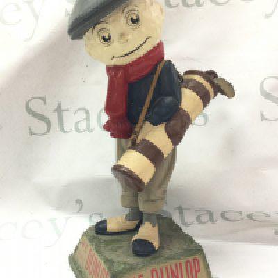 A vintage We Play Dunlop golf advertising figure , 39cm tall.