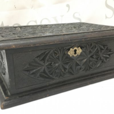 A Victorian carved black jewellery box , lined. Dimensions 18x28x11cm