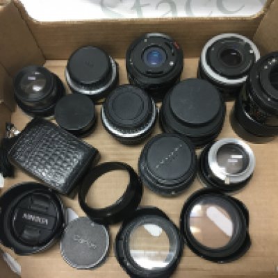 Box of camera lenses including Vivitar, Pentax, , filters, lens cups, Leningrad 4 exposure light meter . Postage category B