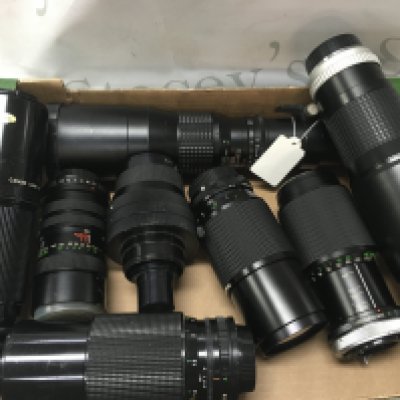 A box of eight large camera lenses including Senator 400mm, Hoya HMC tele auto 400mm, Canon 300mm. Postage category C
