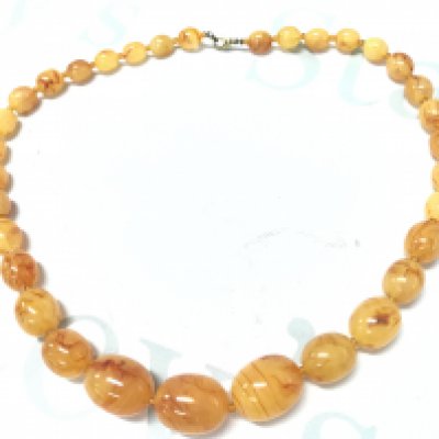A butterscotch amber necklace , 70g , 63cm . Postage category A- NO RESERVE
