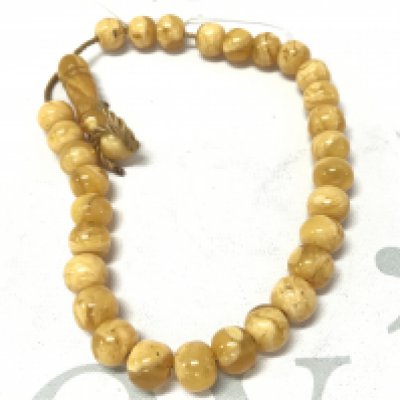 Prayers Bakelite amber style necklace . Postage category A- NO RESERVE