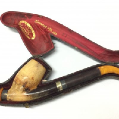 A Victorian pipe with amber mounts in a fitted case. Postage category B