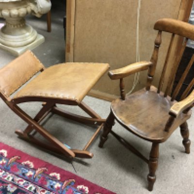 A small childrens chair and a leather and wooden stool.