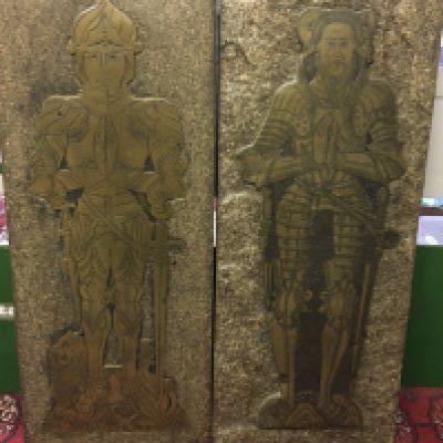 A pair of brass rubbing plaques