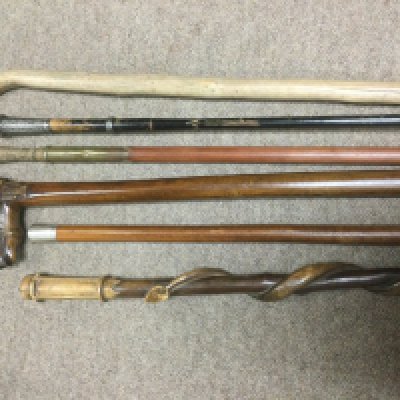 Six walking canes including two with silver mounts. Shipping category D.