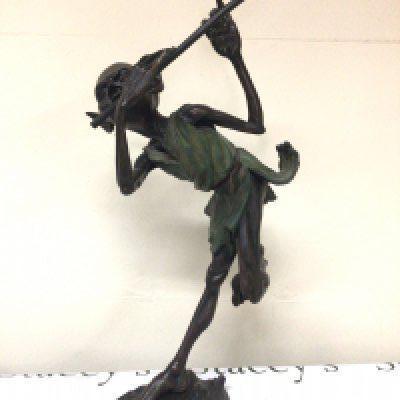 A quality 20th century bronze of a Hoblin playing a flute on a naturalist base the bronze by Julian Jeffrey (b1973) signed base. Hight 73cm