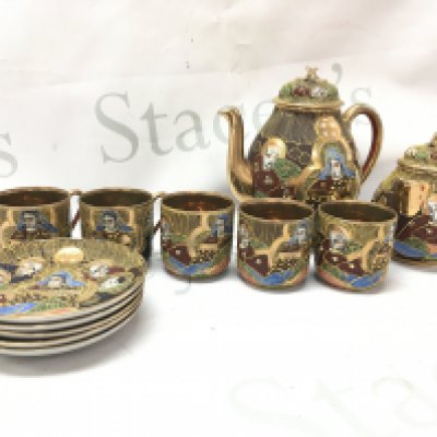 A Japanese part tea set including cups, saucers, milk jug Etc. This lot cannot be posted