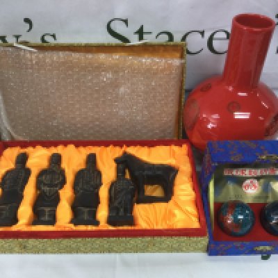 A collection of modern Oriental ornaments including a puzzle ball, vase etc. Shipping category D.