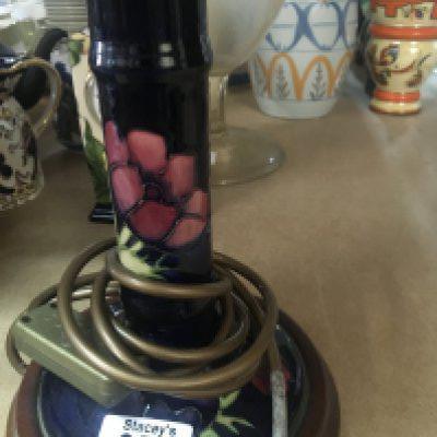 A Moorcroft side lamp decorated with poppies.