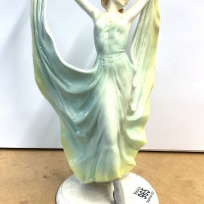 A 1940s Ceramic figure of a dancing lady. 31cm.