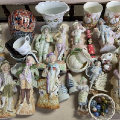 A large collection of Victorian and Edwardian bisque and pottery figures and other ceramics.