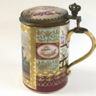 An early 20th century Vienna porcelain tankard with fine guilted detail and classical scene around the tankard, as well as interior designs on the inside of the lid.