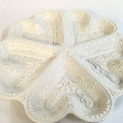 A decorative salt plate 32cm wide. No reserve