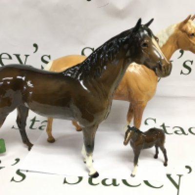 Three Beswick horses comprising two large and one small example, largest heigh approx 30.5cm. Shipping category D.