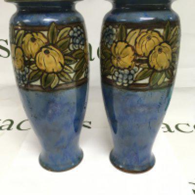 A pair of Royal Doulton vases with banded floral decoration, approx height 27cm. Shipping category D.