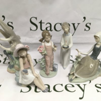 Four Lladro figures and one Nao, all boxed. Shipping category D.